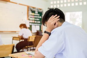 stressed student in a classroom
