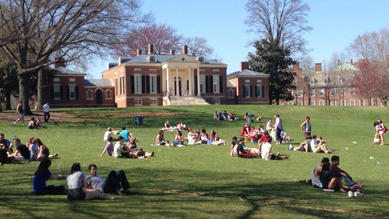 Students lying on a lawn at Johns Hopkins University