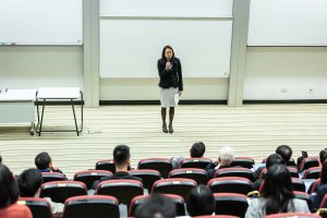 Female speaker talking in a lecture hall