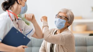 Doctor,And,Senior,Woman,Wearing,Facemasks,During,Coronavirus,And,Flu