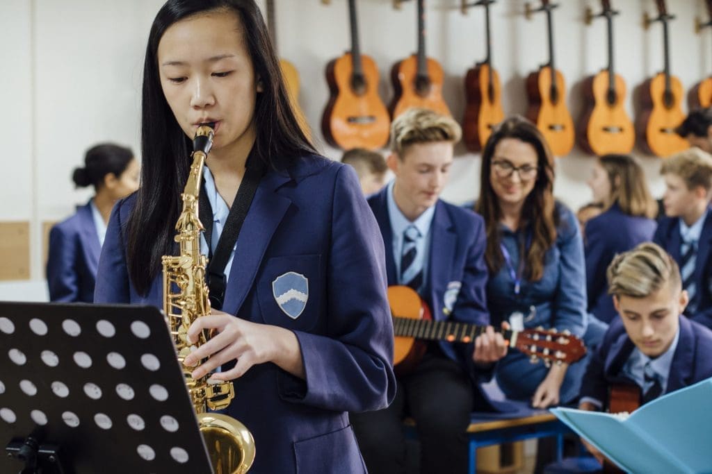 student playing music