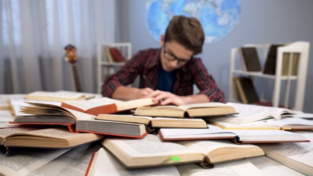 student studying with books