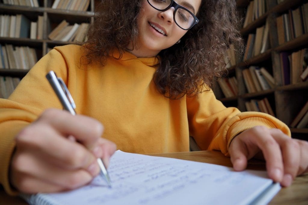 student in library