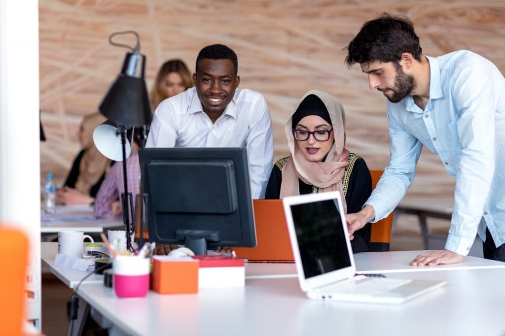 diverse students using laptop