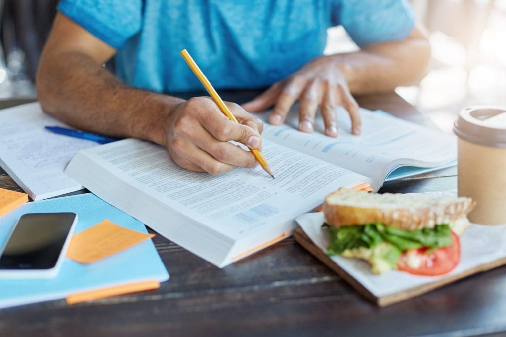 student working at a coffee shop