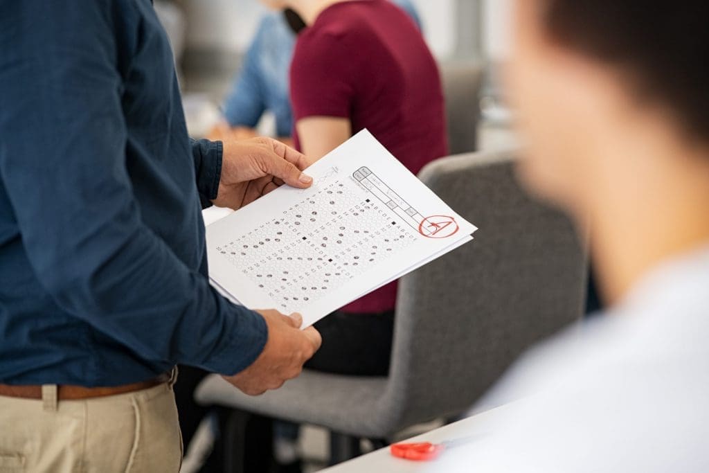 teacher holding test score