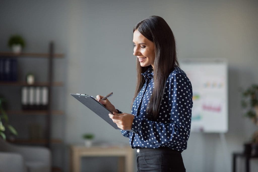 woman holding clipboard