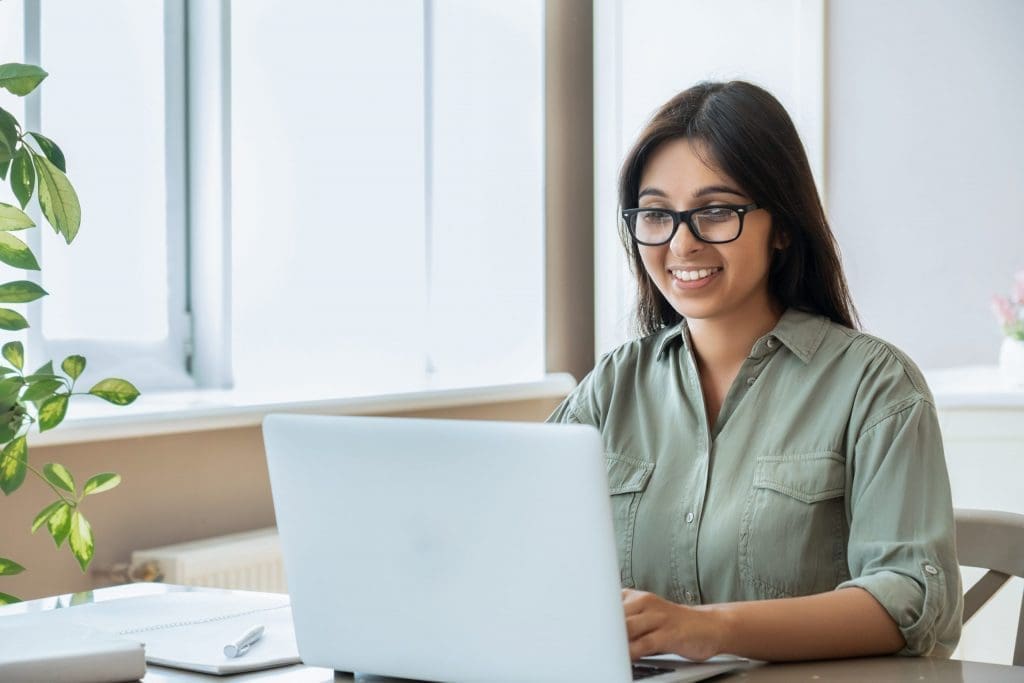 young woman working on laptop