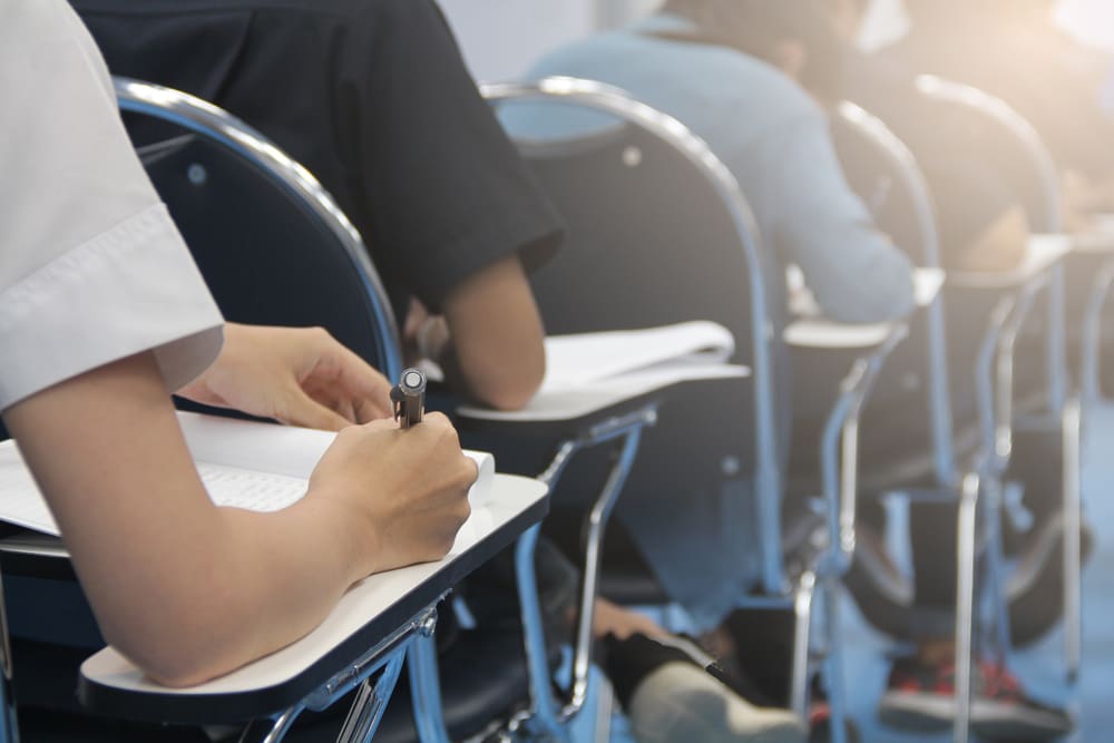 college students writing in exam