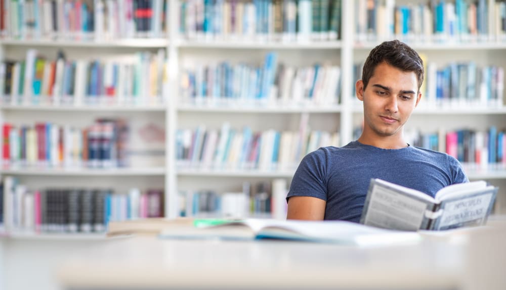 student reading in the library