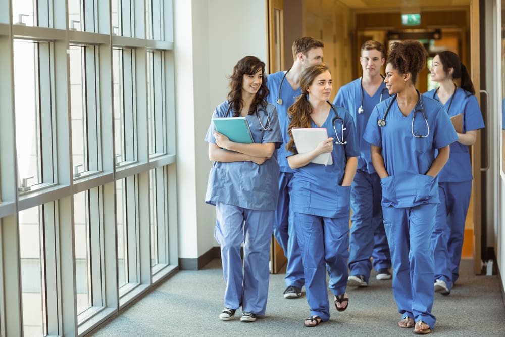medical students walking through corridor