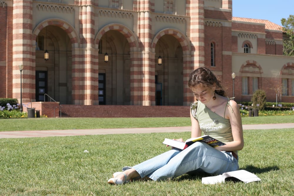 student studying on grass