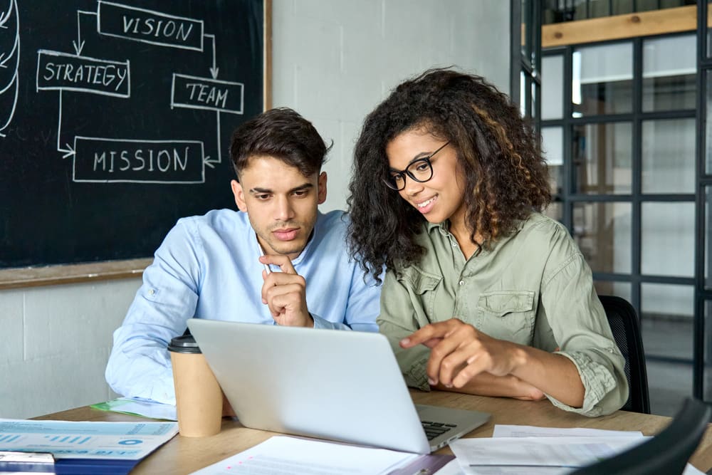 mentor explaining to coworker