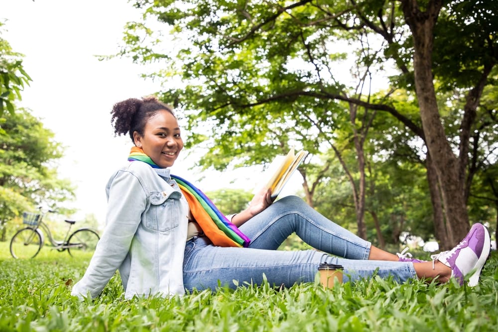 reading a book on grass