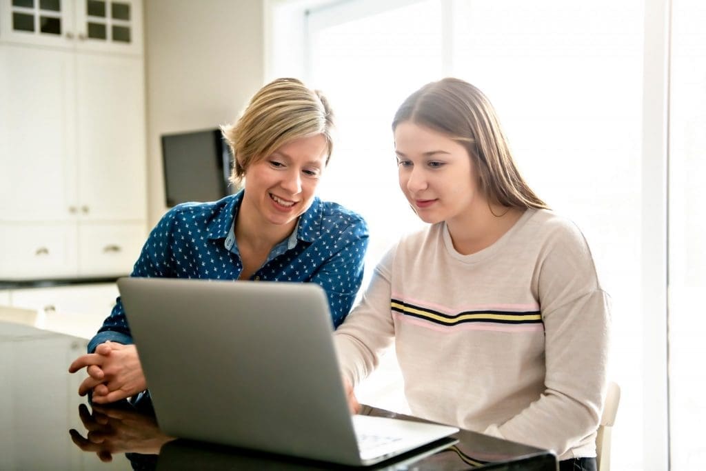 Parent and high school student meeting with a college counselor