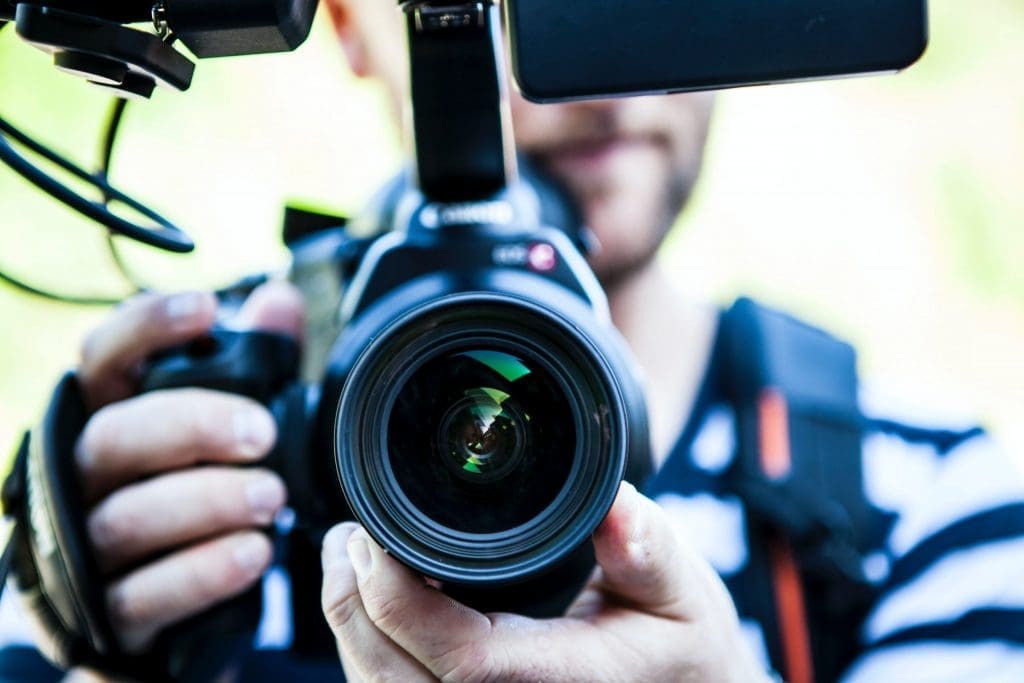 Image of a man holding a camera.