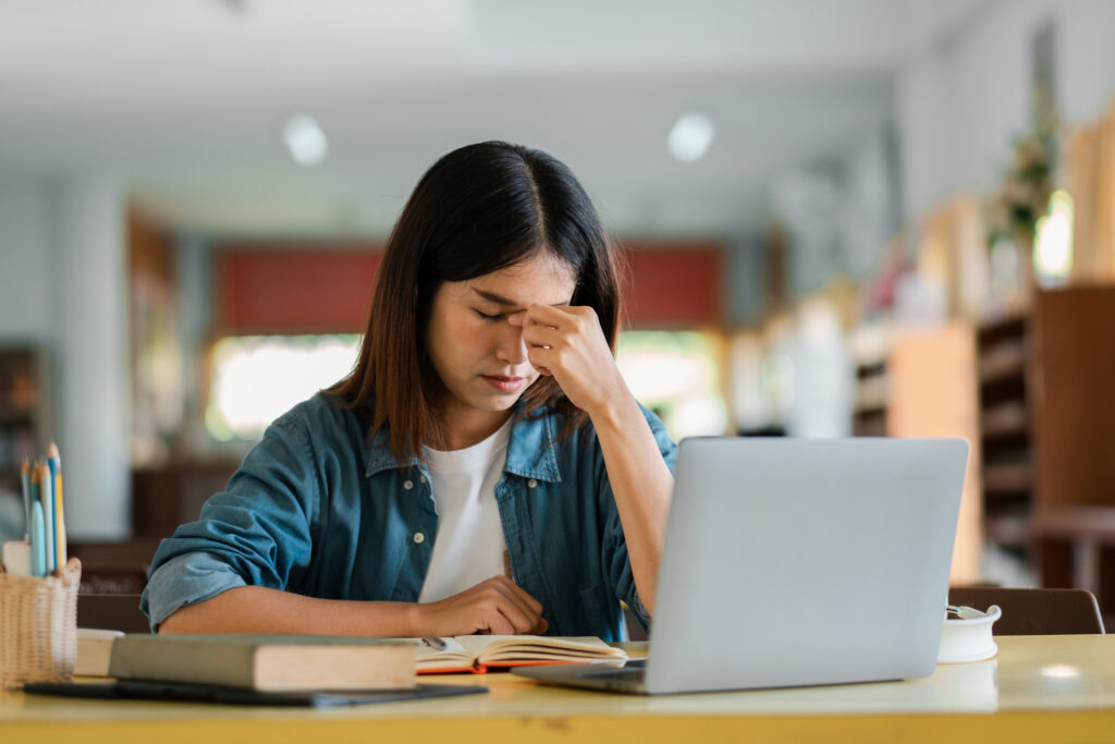 Student studying for the digital SAT and ACT is stressed about deadlines and dates