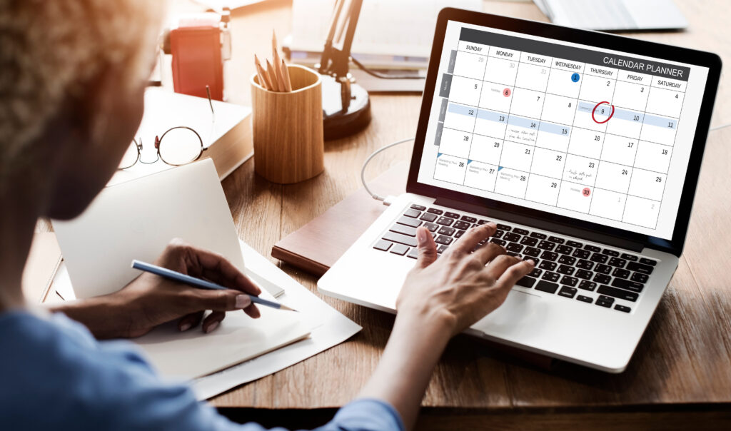 Student updating a digital calendar with early vs regular decision deadlines