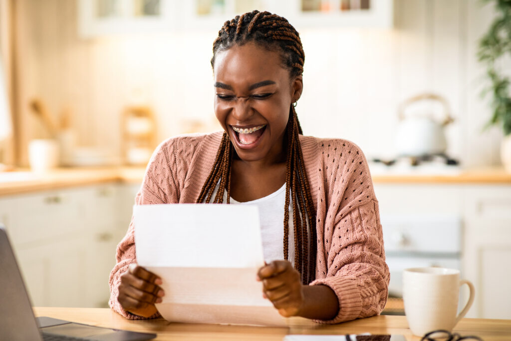 High school student receiving a college acceptance letter