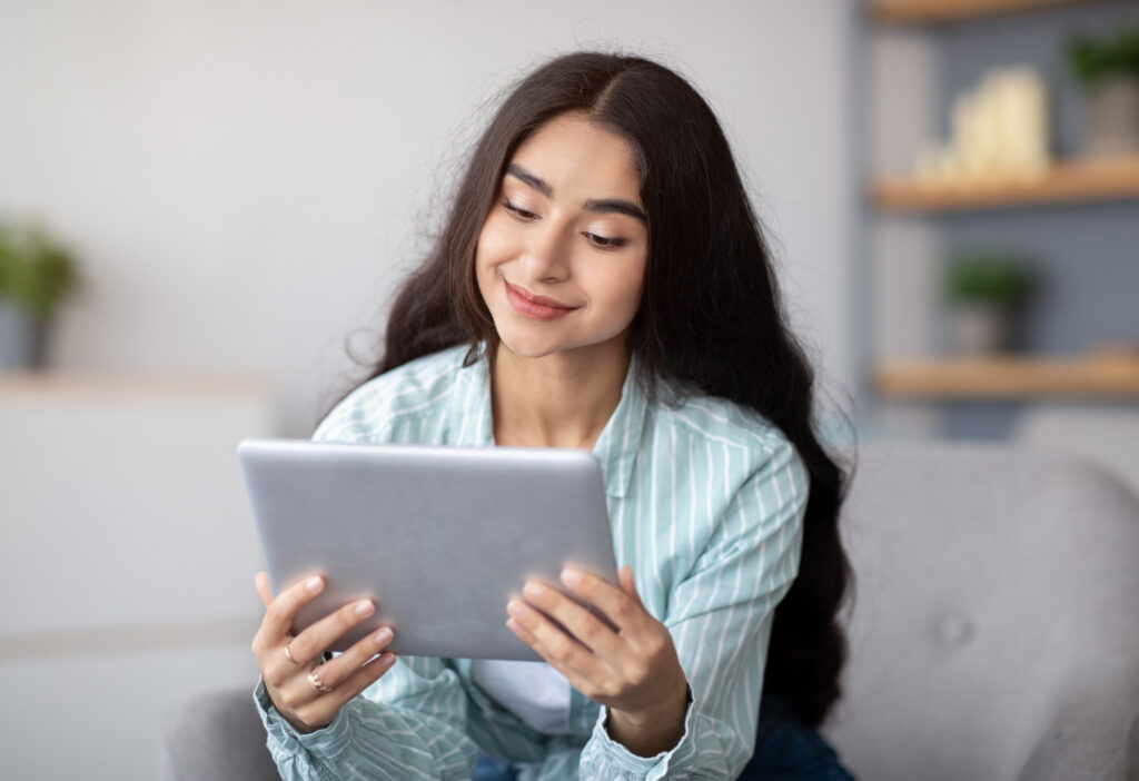 High school student reading email to college admissions officer