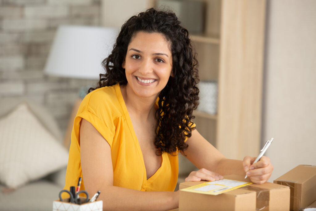Student holding a pencil writing a to do list for college goals 2026