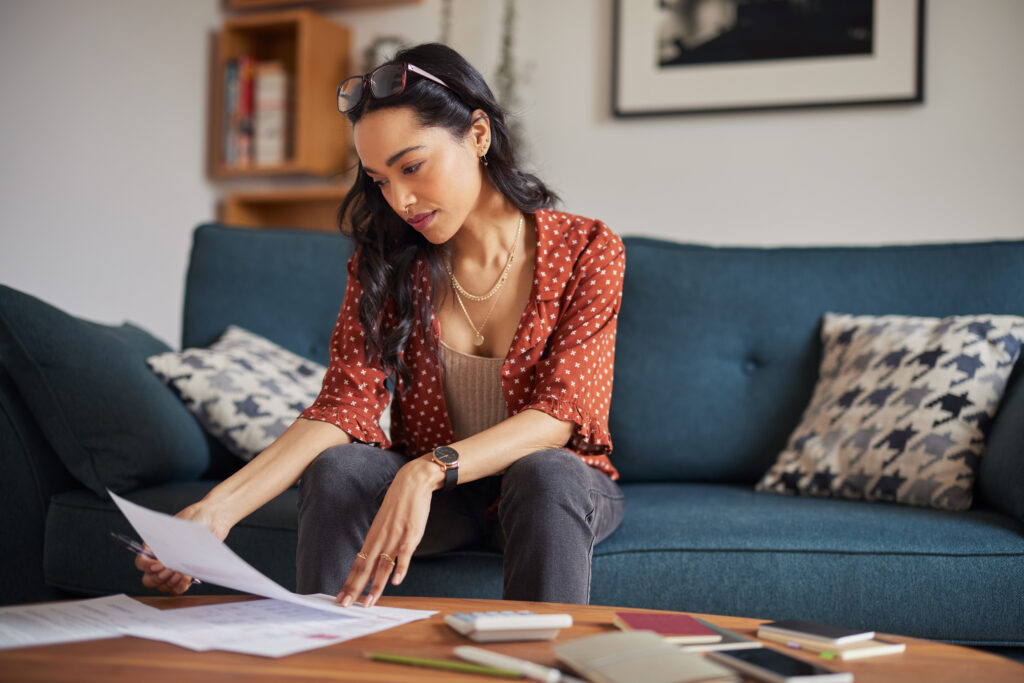 Student reviewing loan paperwork at home