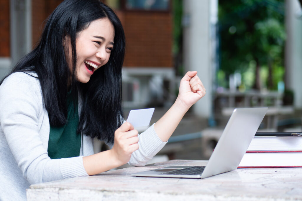 Student winning a scholarship to help with the cost of college and financial aid documents
