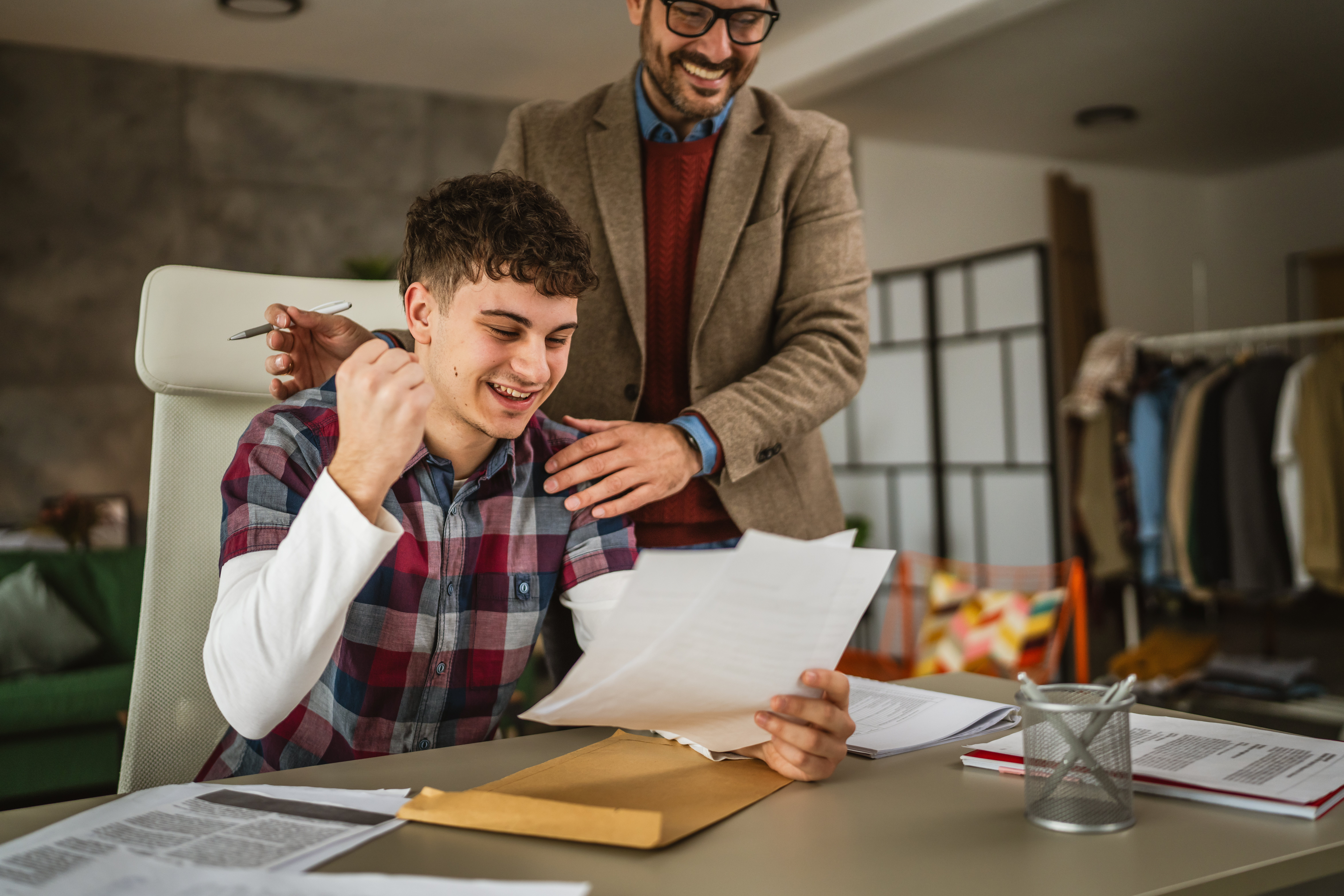 Parent and student receiving a financial aid award letter.